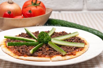 Turkish beef pizza with cucumber on top