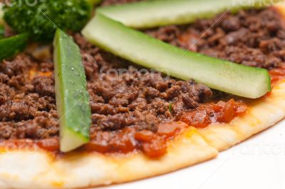 Turkish beef pizza with cucumber on top