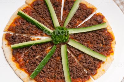 Turkish beef pizza with cucumber on top