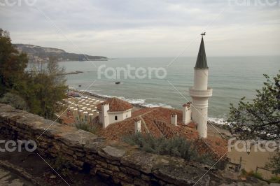 Tower of ancient castle on the sea background