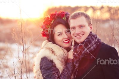 Happy young couple smiling and hugging