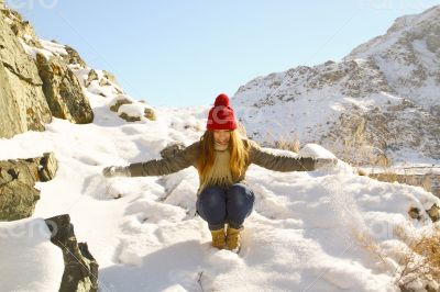 Young girl goes down with a snow mountain 