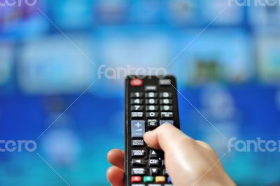 Hand pointing tv remote control 