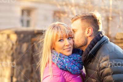 Young man kissing a beautiful woman