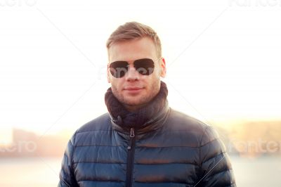 Portrait of young man in sunglasses