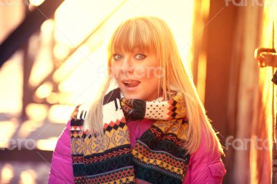 Happy woman sticking out tongue in the sun