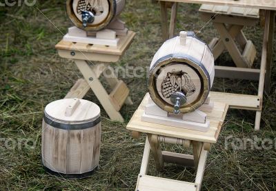 Wooden oak barrel wine, beer with metal crane. 