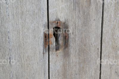 The lock of an old wooden door - background