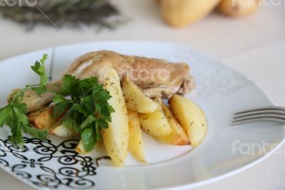 Baked potatoes with chicken and parsley