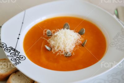 Pumkin cream soup with parmesan cheese