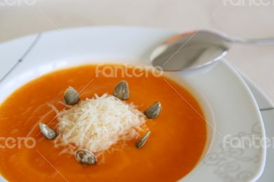 Pumkin cream soup with parmesan cheese