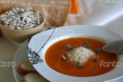 Pumkin cream soup with its ingridients in the background