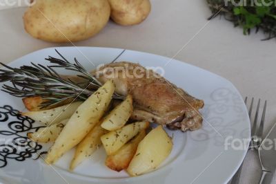 Backed potatoes and chicken with rosemary