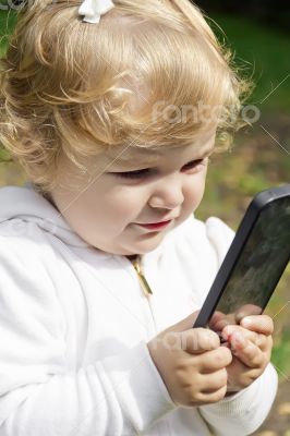 Cute infant with cellular