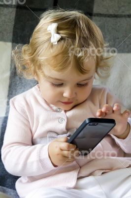 Cute infant with cellular