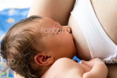 Sleeping eating cute newborn