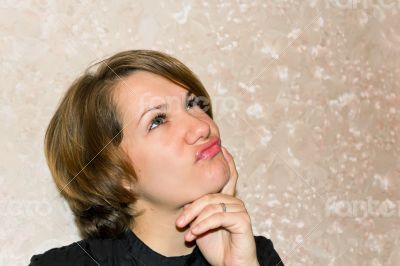Thinking woman with brown hair