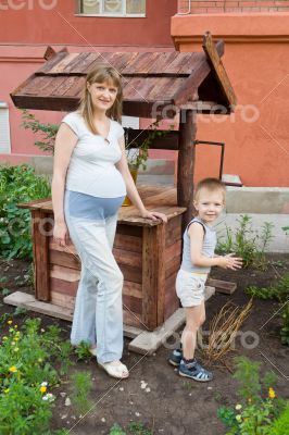 Pregnant mother and son on walk