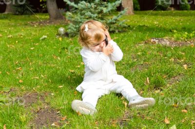 Cute infant with cellular