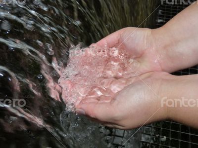 Hands in water