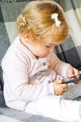 Cute infant with cellular