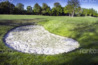 Sand bunkers on the golf course.