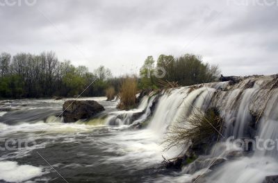 Threshold of the mountain river and wet stones