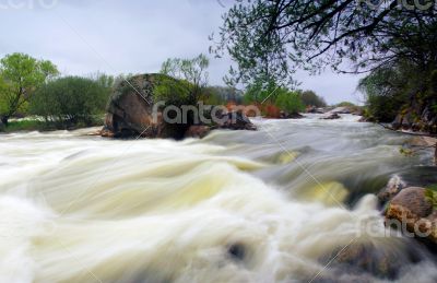Threshold of the mountain river and wet stones