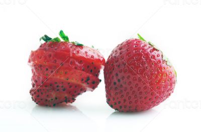 Healthy red strawberry fruit sliced isolated on the white backgr