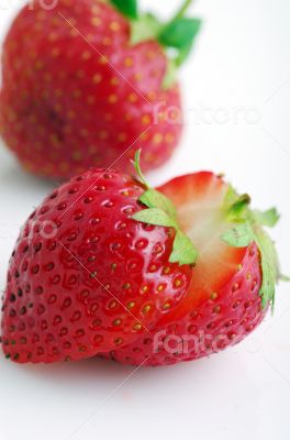 Healthy red strawberry fruit sliced isolated on the white backgr