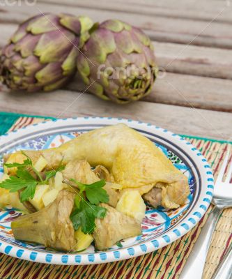 Stewed artichoke with potatoes and chicken