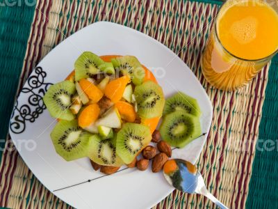 Exotic fruit salad in the orange skin.Top view