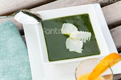 Spinach cream soup with parmesan.