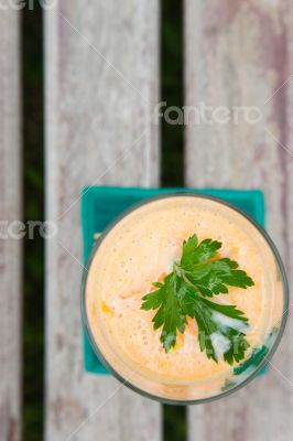 Carrot smootie with fresh parsley leaves