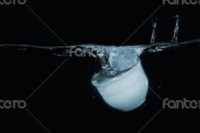 Coffee cup dropped into water