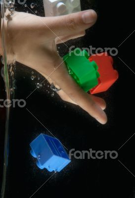 Toys dropped into water