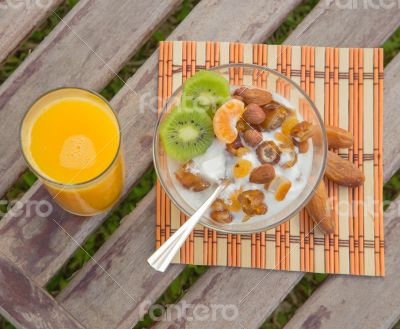 Healthy dessert and a glass of orange juice