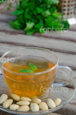 Traditional tunisian green tea with peppermint and nuts