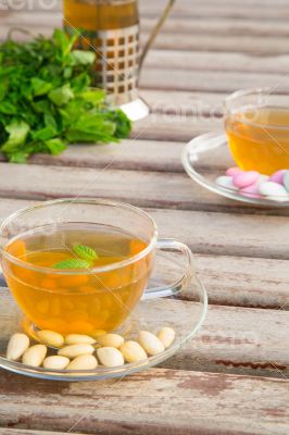 Traditional tunisian green tea with peppermint and nuts