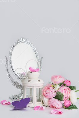 White decoration of cage, lantern and silver mirror