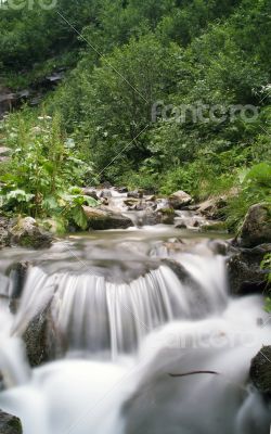 landscape with waterfall in the mountains 