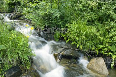 landscape with waterfall in the mountains 