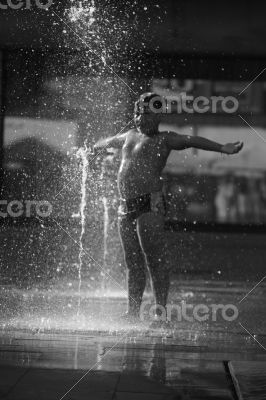 Kid in a fountain.