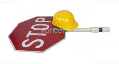 Stop Sign on a Short Pole with a Construction Hat