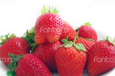 Three fresh strawberries isolated on white background. 