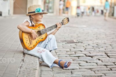 Girl playing guitar on the street