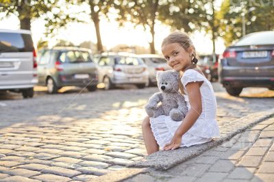 Young lonely girl on a city street