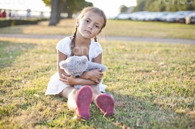 Sad child in a park