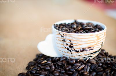 Coffee beans in a cup of coffee