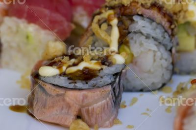 Sushi rolls with vassabi on the plate